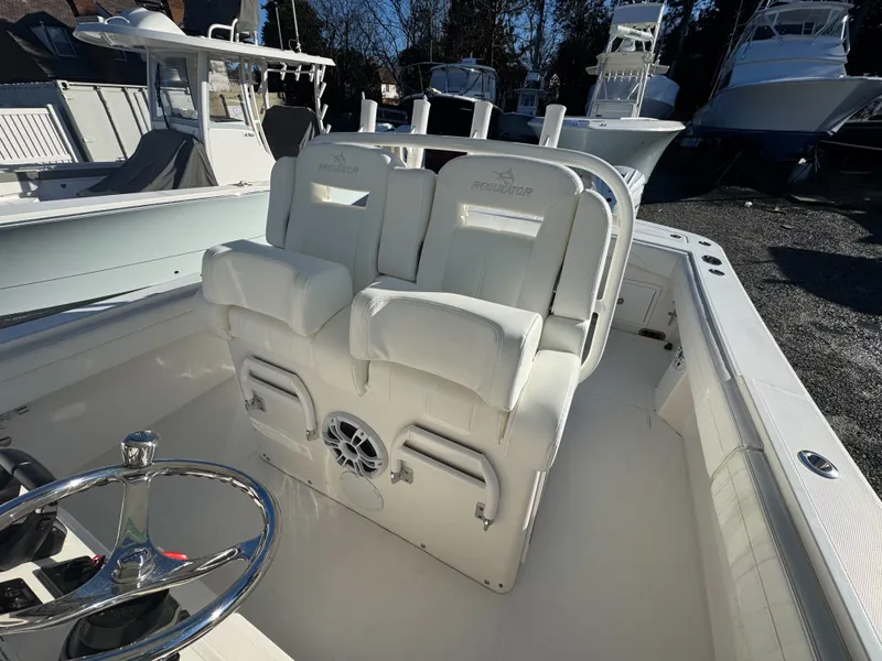 Slide: The Image of Interior of a 2022 Regulator 31 boat with white seating. - 22
