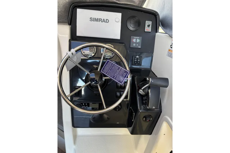 Slide: The Image of Steering console of 2026 Trophy T 25 Explorer boat with Simrad display. - 12