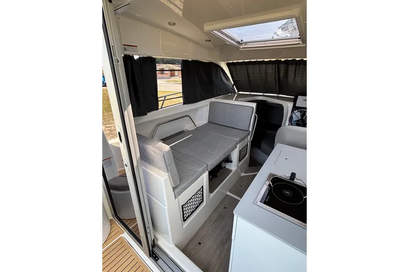Slide: The Image of Interior of 2026 Trophy T 25 Explorer boat with seating and kitchenette. - 16