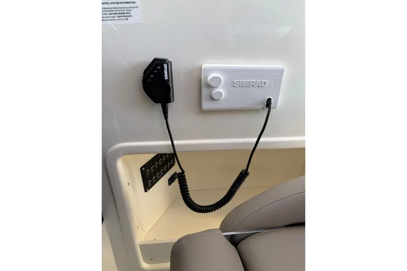 Slide: The Image of Simrad marine radio system in 2026 Trophy T 25 Explorer boat interior. - 7