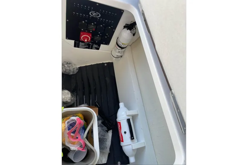 Slide: The Image of Interior of 2022 Cobalt R4 Outboard boat with storage compartment and control panel. - 12