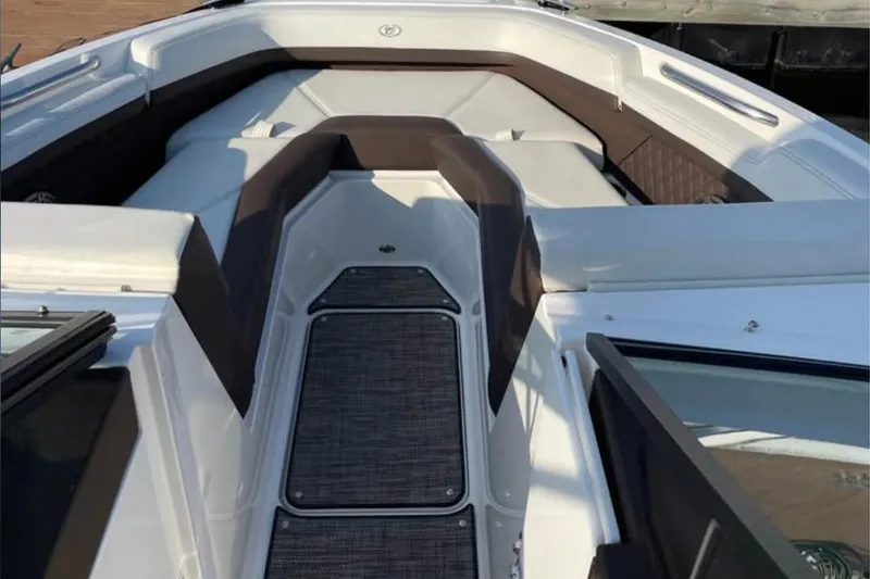 Slide: The Image of 2022 Cobalt R4 Outboard boat interior with cushioned seating and sleek design. - 5