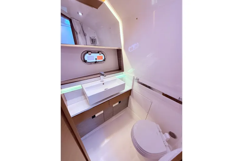 Slide: The Image of Luxurious 2022 Tiara Yachts 38 LS bathroom with modern sink and toilet. - 10