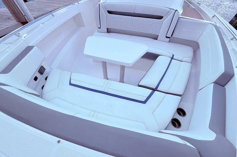 Slide: The Image of Luxurious seating area on 2022 Tiara Yachts 38 LS with elegant white upholstery. - 12