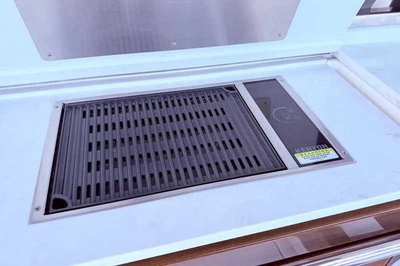 Slide: The Image of Built-in Kenyon grill on 2022 Tiara Yachts 38 LS, featuring sleek design and functionality. - 8