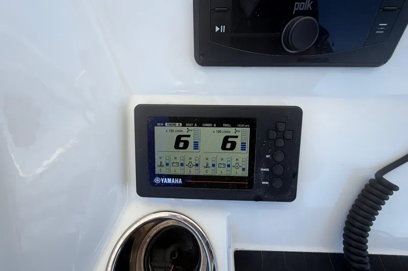 Slide: The Image of 2019 Regulator 25 boat docked at marina, showcasing spacious bow seating area. - 17