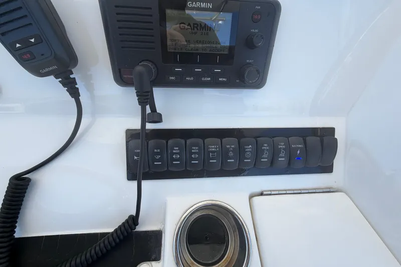 Slide: The Image of 2019 Regulator 25 boat seat with gray and white upholstery. - 18