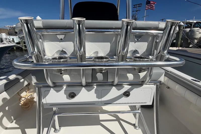 Slide: The Image of 2019 Regulator 25 boat interior with marine toilet and control panel. - 20