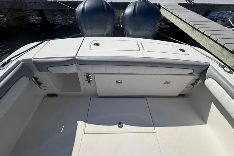 Slide: The Image of 2019 Regulator 25 boat dashboard with navigation screens and steering wheel. - 21