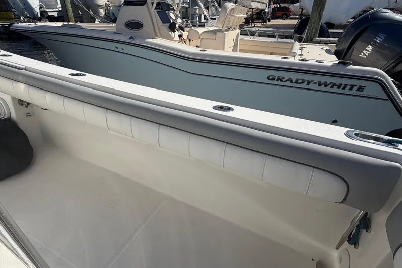 Slide: The Image of 2019 Regulator 25 boat with Garmin fishfinder displaying sonar data on screen. - 23