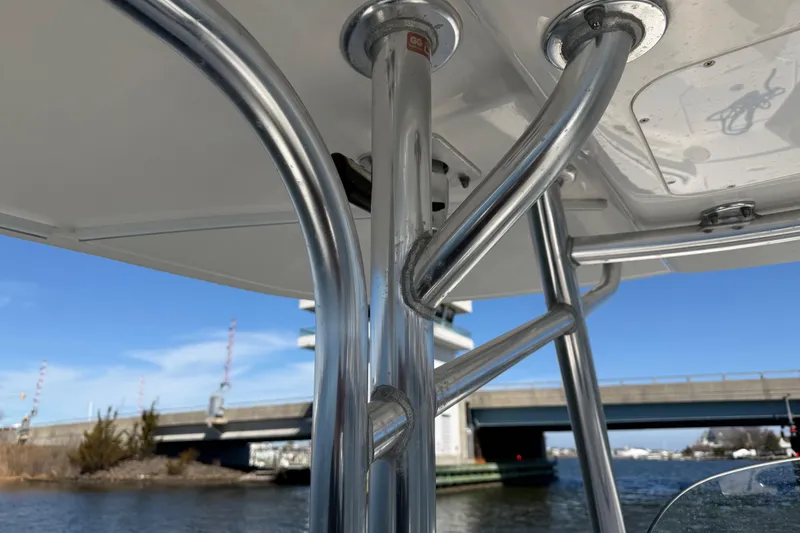 Slide: The Image of 2019 Regulator 25 boat interior with dual engines and dock view. - 32