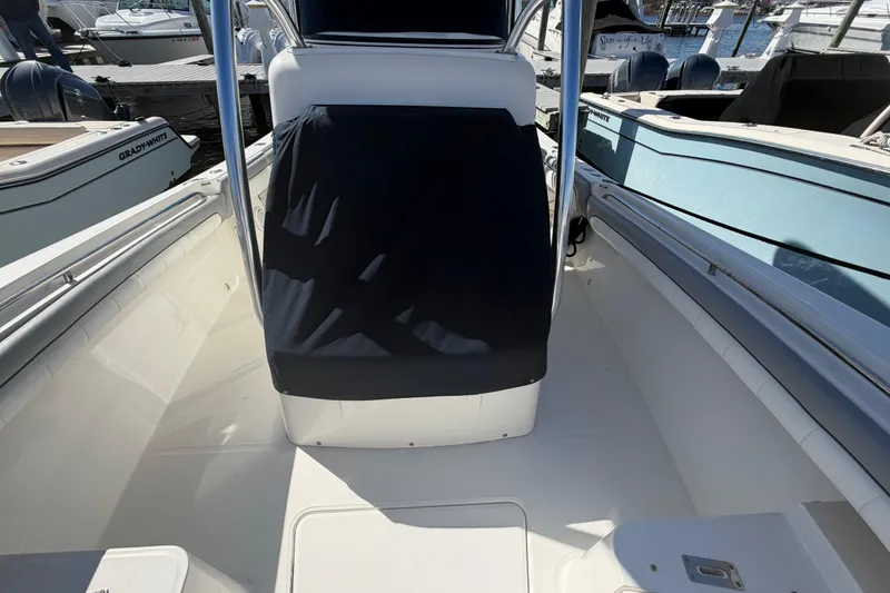 Slide: The Image of 2019 Regulator 25 boat interior with Grady-White in background at marina. - 34