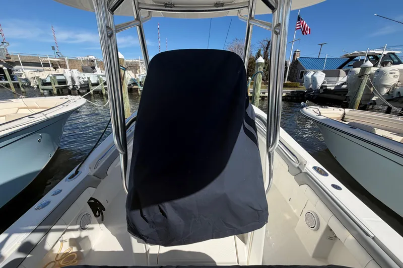 Slide: The Image of 2019 Regulator 25 boat fuel ports with caution label and chrome fittings. - 36