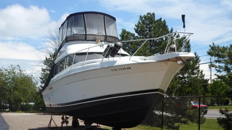The Image of 1993 Silverton 37 Convertible boat on land, side view. - 1