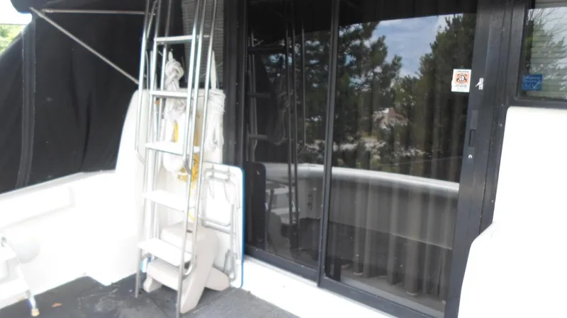 Slide: The Image of 1993 Silverton 37 Convertible boat with ladder and equipment. - 10