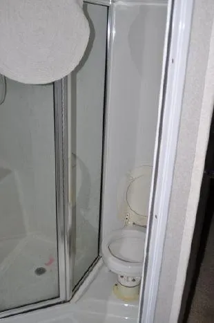 Slide: The Image of Bathroom in 1993 Silverton 37 Convertible boat. - 19