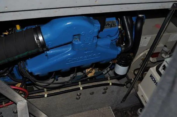 Slide: The Image of 1993 Silverton 37 Convertible engine room with blue engine. - 22