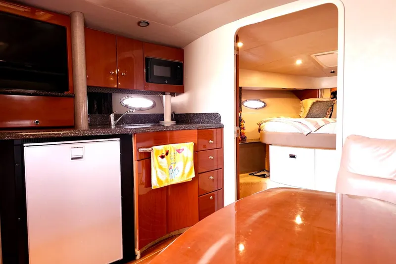 Slide: The Image of 2004 Formula 40 Performance Cruiser interior with kitchenette and cozy bedroom. - 15
