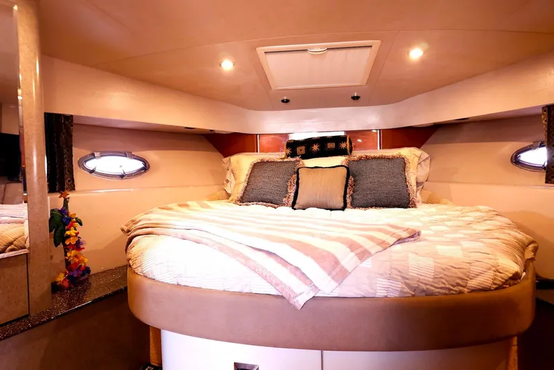 Slide: The Image of Luxurious cabin interior of 2004 Formula 40 Performance Cruiser with cozy bedding. - 16