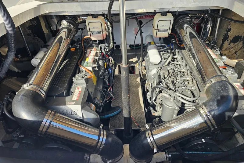 Slide: The Image of Engine compartment of a 2004 Formula 40 Performance Cruiser, showcasing dual engines and components. - 17