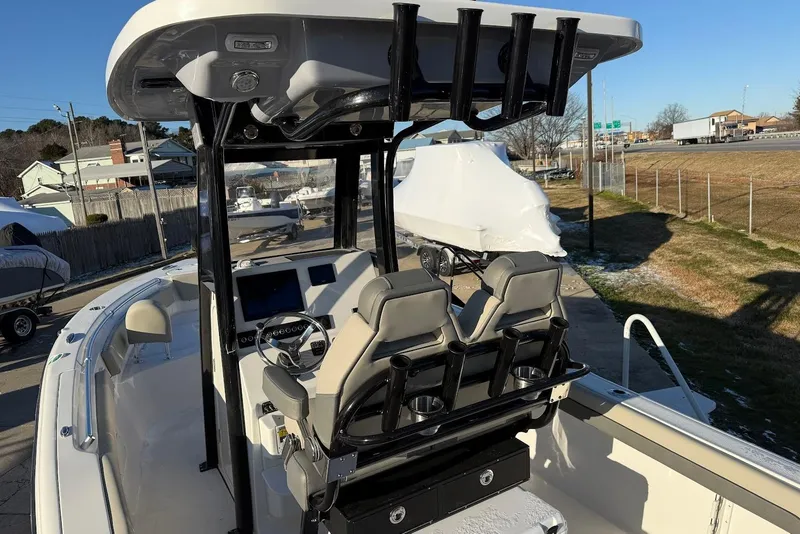 Slide: The Image of 2026 Key West 239 FS boat interior with dual seats and steering console. - 10