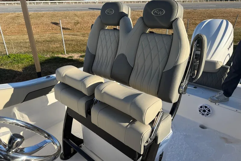 Slide: The Image of 2026 Key West 239 FS boat seats with diamond stitching and steering wheel. - 12