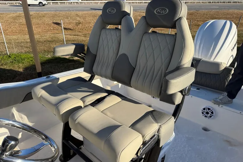 Slide: The Image of 2026 Key West 239 FS boat seats with diamond-stitched upholstery and armrests. - 13