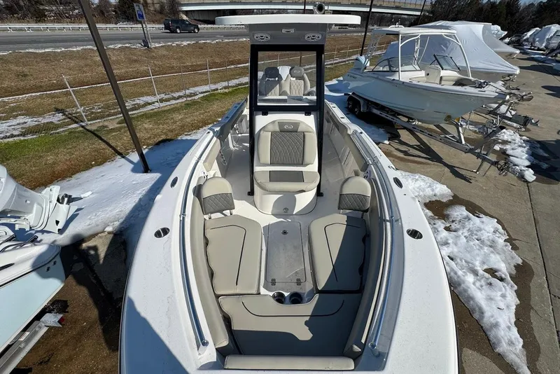 Slide: The Image of 2026 Key West 239 FS boat with sleek seating, parked on snowy ground. - 25