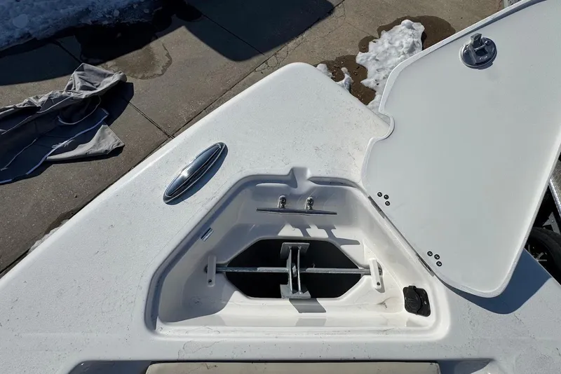 Slide: The Image of Open anchor compartment on 2026 Key West 239 FS boat, dockside view. - 27
