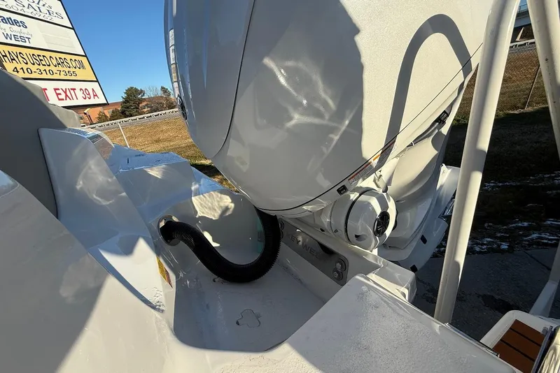 Slide: The Image of 2026 Key West 239 FS boat engine detail with outdoor background. - 9