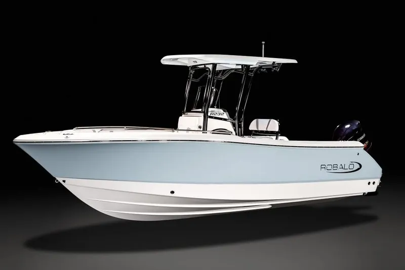The Image of Manufacturer Provided Image: 2025 Robalo R232 Explorer boat cruising on a lake with passengers onboard. - 0