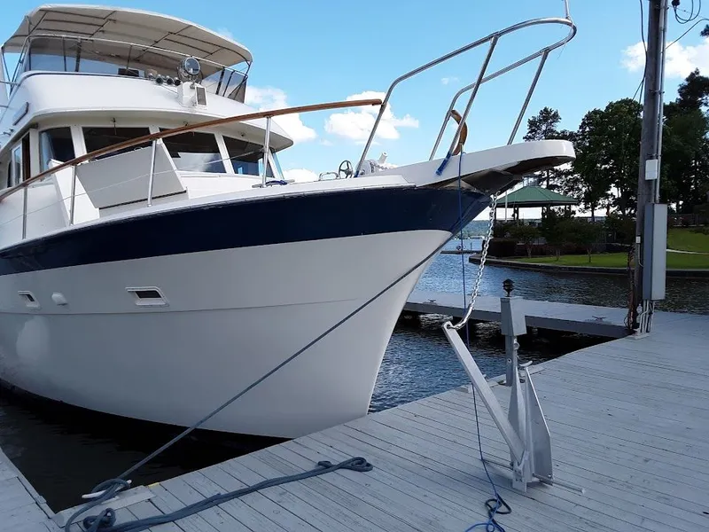 Slide: The Image of 1975 Hatteras 58L Long Range Cruiser docked. - 2