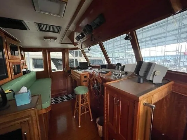 Slide: The Image of 1975 Hatteras 58L Long Range Cruiser in harbor, deck view. - 21