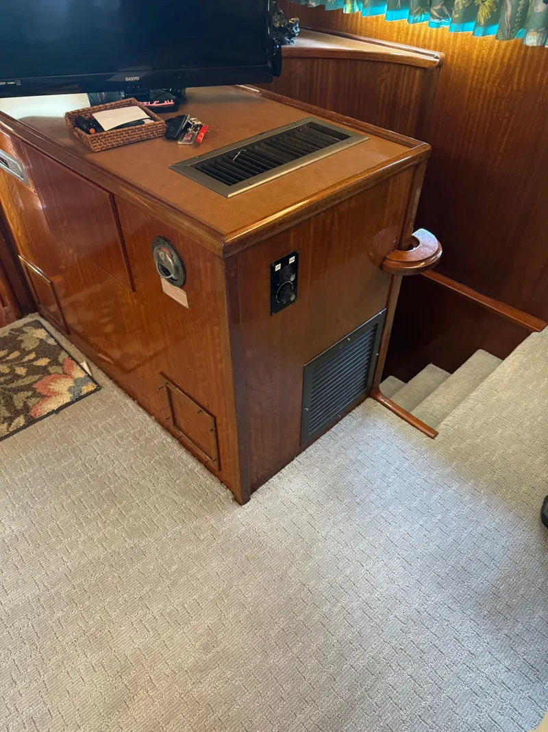 Slide: The Image of Interior of 1975 Hatteras 58L Long Range Cruiser with green couch. - 22