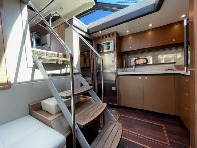 Slide: The Image of Cup holders on 2016 Sea Ray 510 DA boat. - 26