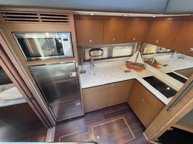 Slide: The Image of Close-up of a 2016 Sea Ray 510 DA yacht at the dock. - 28