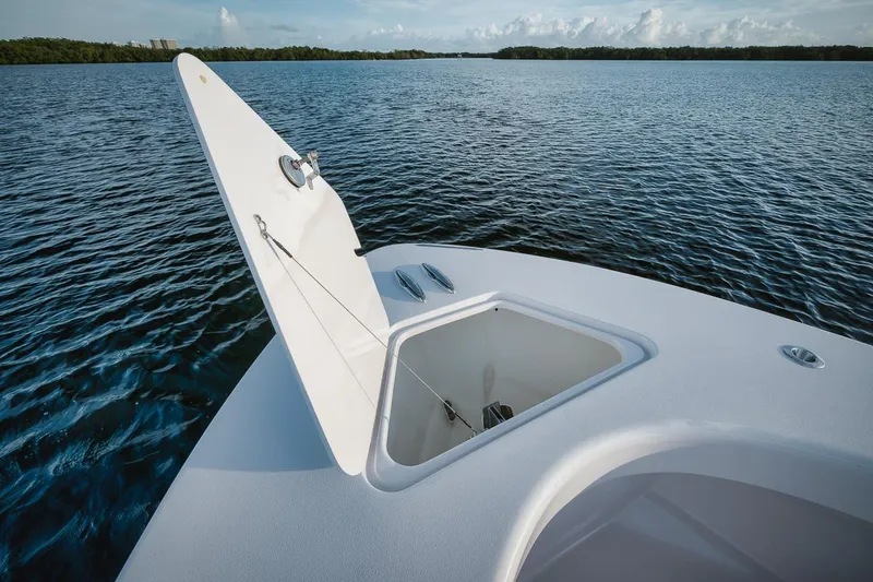 Slide: The Image of 2024 Birdsall 30 boat with open storage compartment on calm water. - 13