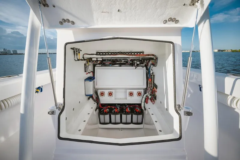 Slide: The Image of Birdsall 30 2024 boat electrical compartment with wiring and batteries. - 16