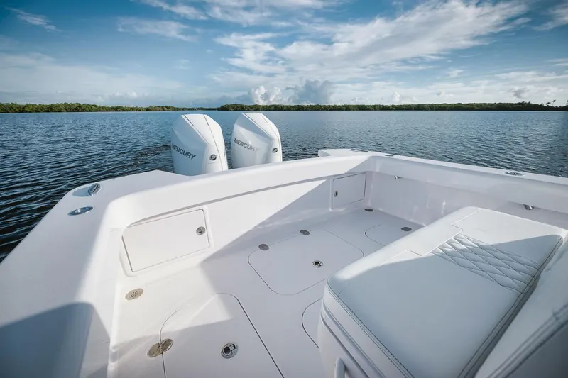 Slide: The Image of 2024 Birdsall 30 boat with twin Mercury engines on a calm lake. - 22