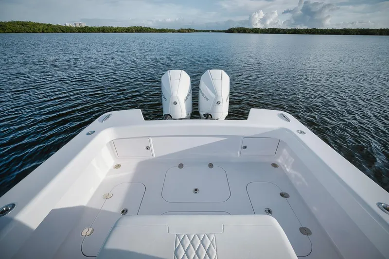 Slide: The Image of 2024 Birdsall 30 boat with twin engines on a calm lake. - 23