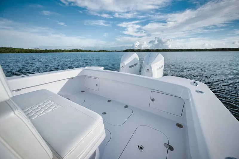 Slide: The Image of 2024 Birdsall 30 boat with twin outboard motors on a calm lake. - 24