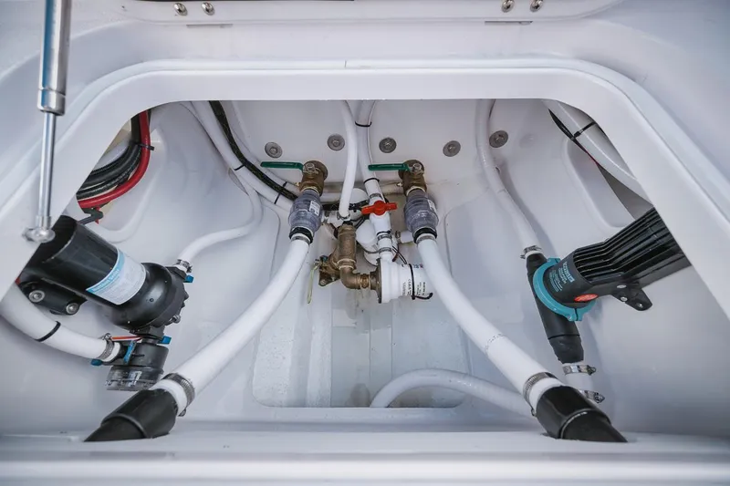 Slide: The Image of Birdsall 30 2024 model boat plumbing system with hoses and valves. - 30