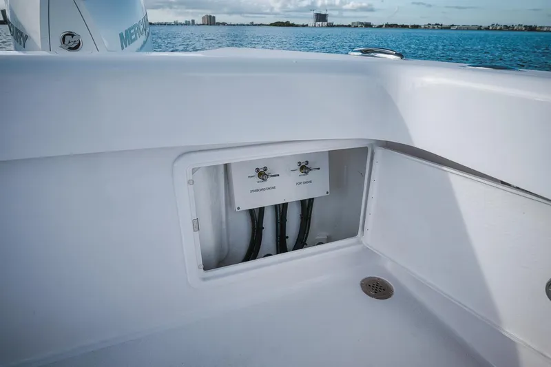 Slide: The Image of Birdsall 30 boat 2024 model, open hatch with wiring, ocean background. - 31
