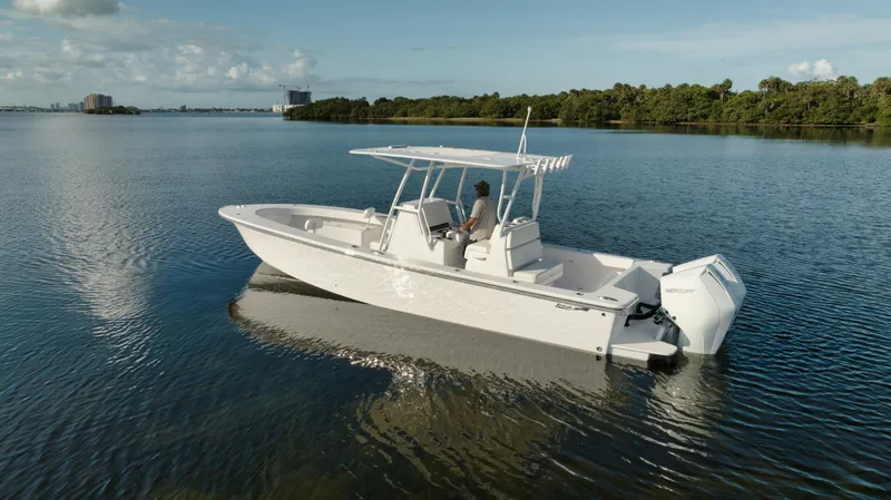 Slide: The Image of 2024 Birdsall 30 boat cruising on a calm lake with scenic background. - 43