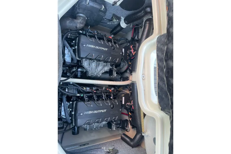 Slide: The Image of 2014 Yamaha Boats 242 Limited S engine compartment with dual high output engines. - 12