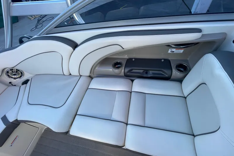 Slide: The Image of Luxurious seating on 2014 Yamaha Boats 242 Limited S, featuring sleek white upholstery. - 14