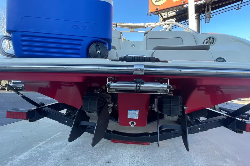 Slide: The Image of Rear view of a 2014 Yamaha Boats 242 Limited S with a blue cooler. - 17