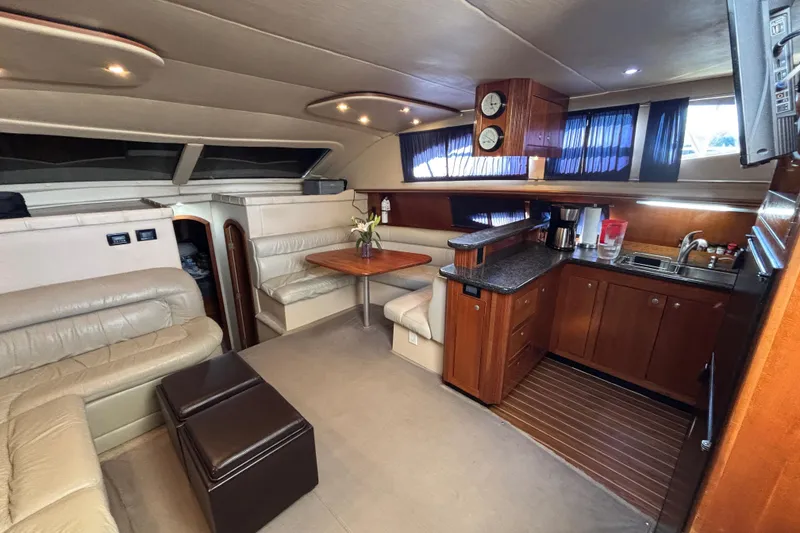 Slide: The Image of Luxurious interior of 2005 Cruisers Yachts 455 Express Motoryacht with leather seating cherrywood table and elegant decor. - 13