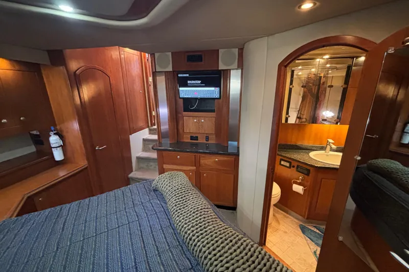 Slide: The Image of Luxurious Master Stateroom  of 2005 Cruisers Yachts 455 Express Motoryacht with Queen Berth and cherrywood cabinetry - 21