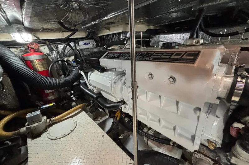 Slide: The Image of Engine compartment of a 2005 Cruisers Yachts 455 Express Motoryacht, showcasing detailed mechanical components. - 30